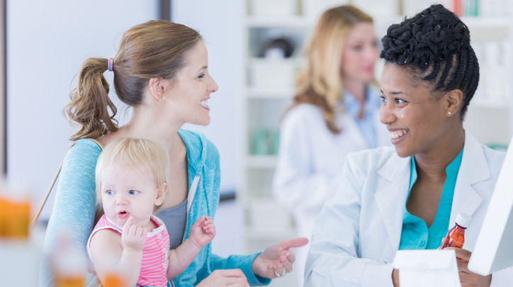 Female Pharmacist with Female Patient and Baby